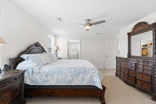 bedroom featuring ceiling fan and light carpet