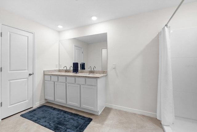 bathroom featuring vanity, tile patterned flooring, and a shower with curtain