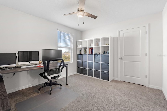 office with light colored carpet and ceiling fan