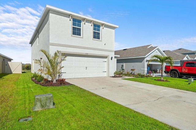 view of front facade with a garage and a front yard