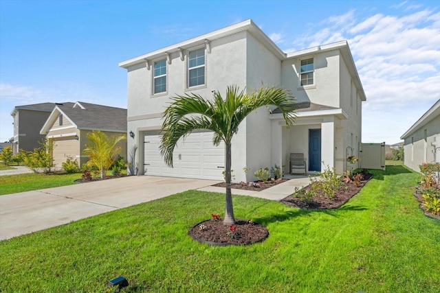 view of front of property featuring stucco siding, driveway, a front yard, and an attached garage