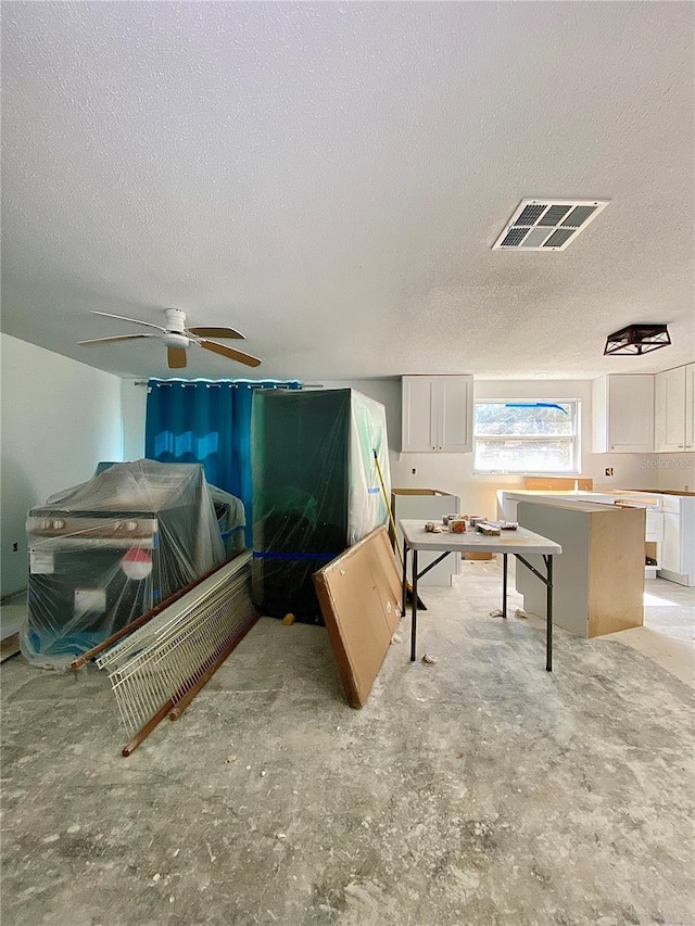 living room with a textured ceiling