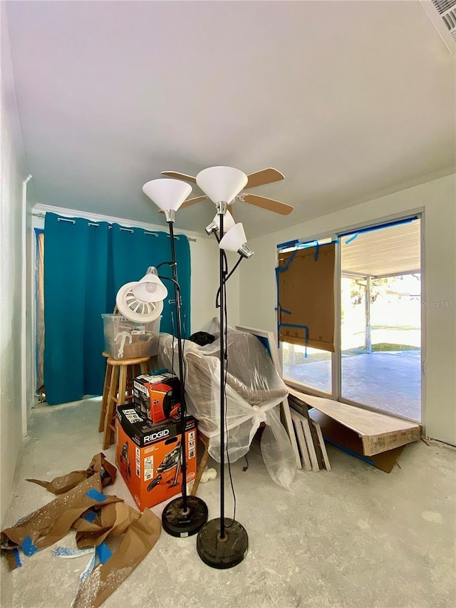 bedroom with ceiling fan and concrete flooring