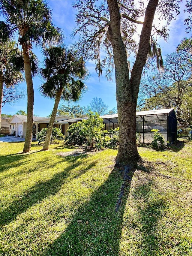 view of yard featuring a lanai