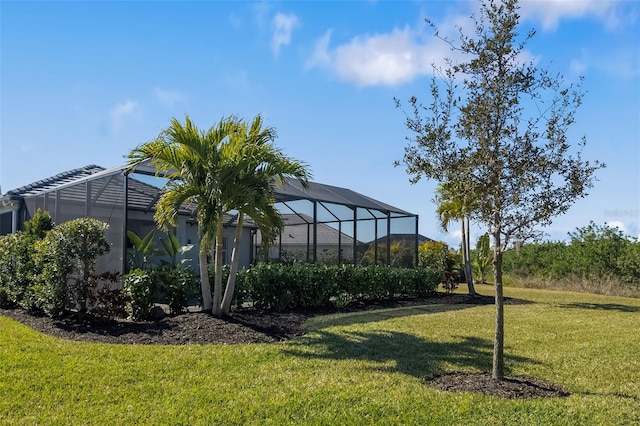 view of yard featuring glass enclosure