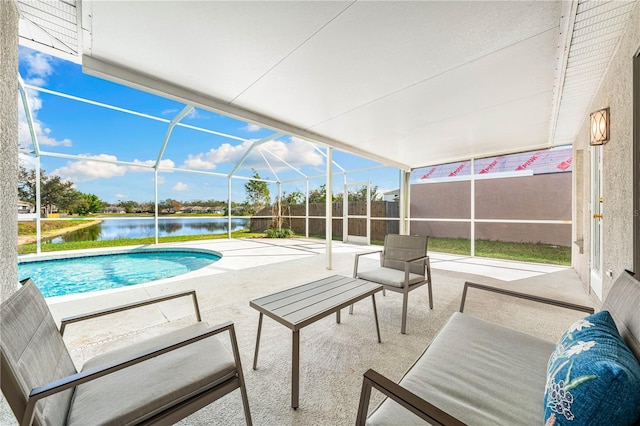 view of pool with a water view, glass enclosure, and a patio area