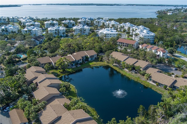 birds eye view of property featuring a residential view and a water view