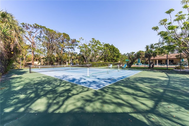 view of sport court featuring fence