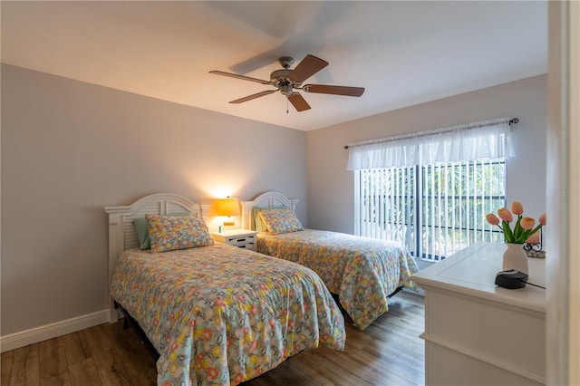 bedroom with a ceiling fan, access to outside, wood finished floors, and baseboards