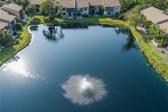 drone / aerial view with a water view and a residential view