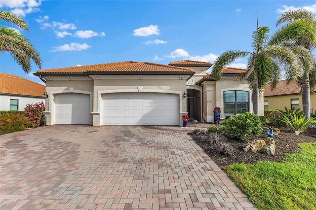 mediterranean / spanish-style home with a garage