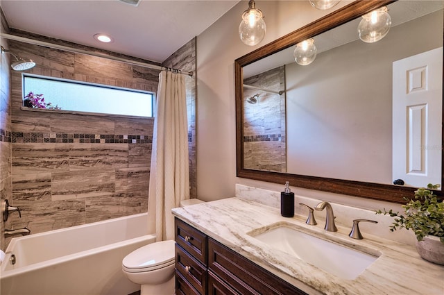 full bath with vanity, toilet, and shower / bath combo with shower curtain