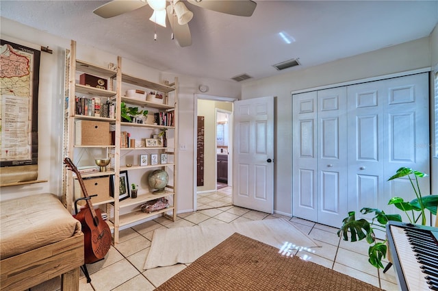 sitting room with light tile patterned floors, baseboards, and visible vents