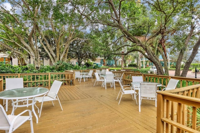 wooden deck featuring outdoor dining space