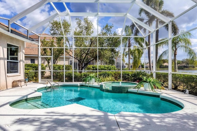 view of swimming pool featuring a patio area, a pool with connected hot tub, and glass enclosure