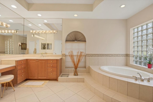 full bath featuring a garden tub, tile patterned flooring, vanity, and recessed lighting