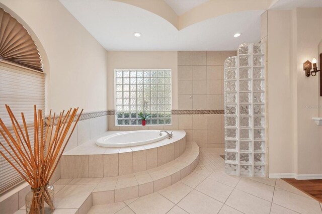 full bath featuring tile patterned flooring, a walk in shower, recessed lighting, and a bath