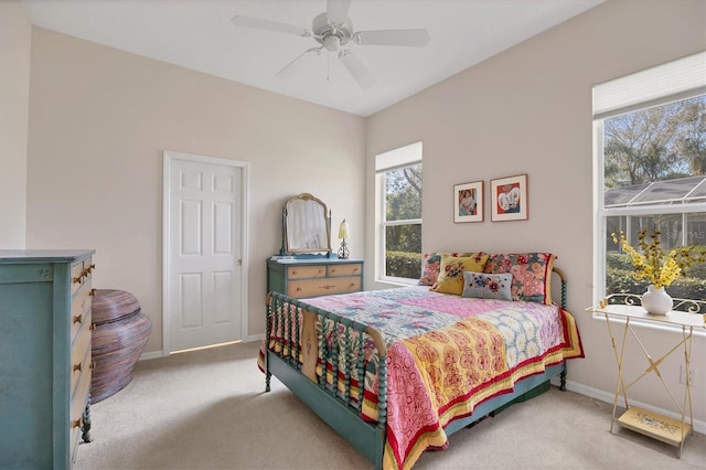 carpeted bedroom featuring a ceiling fan and baseboards