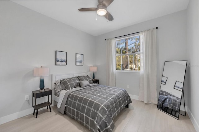 bedroom featuring ceiling fan and light hardwood / wood-style flooring