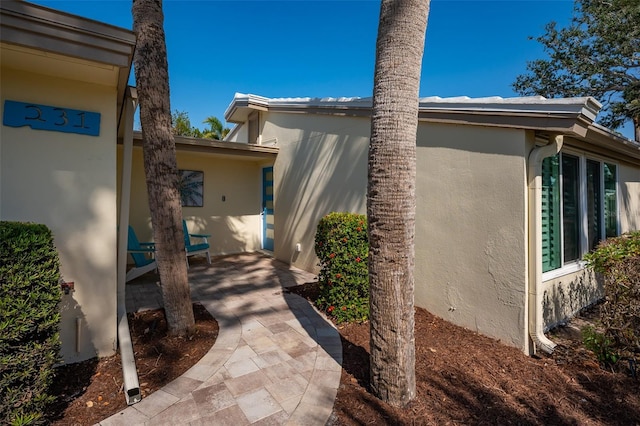 view of property exterior featuring a patio area