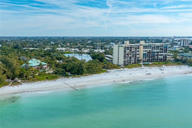 bird's eye view featuring a view of the beach and a water view