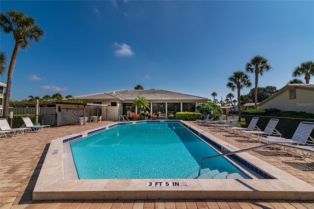 view of pool featuring a patio