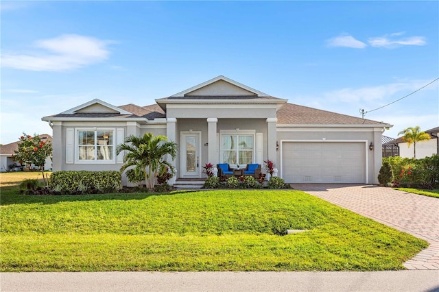 view of front of home featuring a garage and a front yard