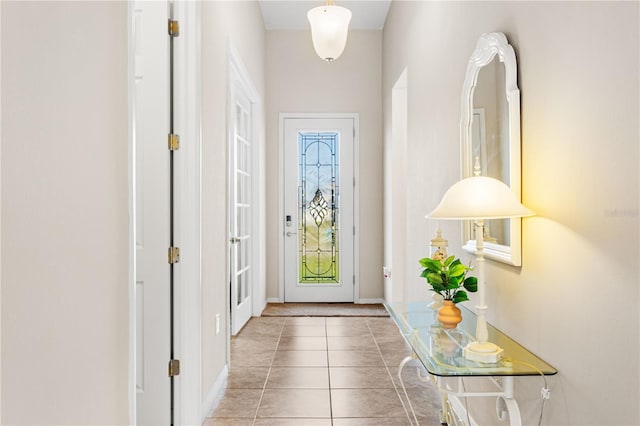 entryway with tile patterned floors