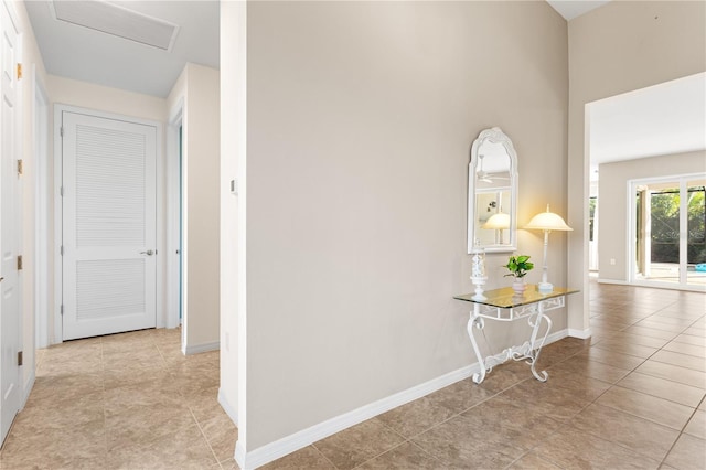 corridor featuring light tile patterned floors