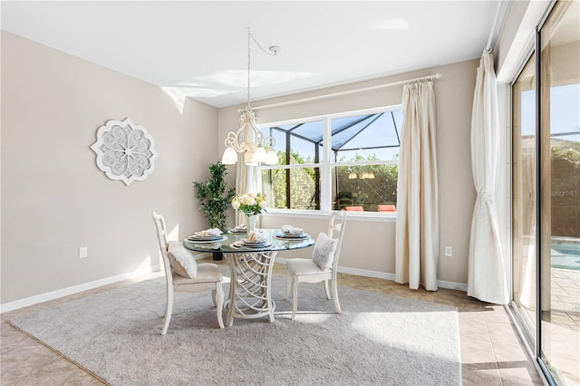 dining room featuring an inviting chandelier and light tile patterned floors