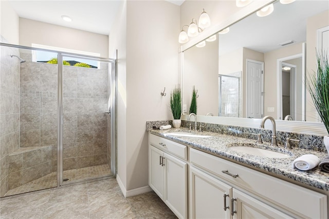 bathroom featuring vanity and a shower with door