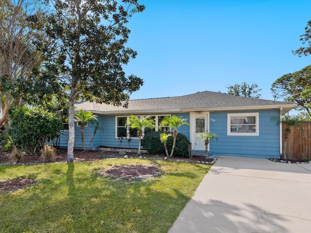 ranch-style home with a front yard