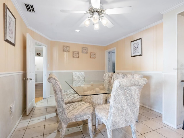 dining room with ornamental molding, ceiling fan, and light tile patterned flooring