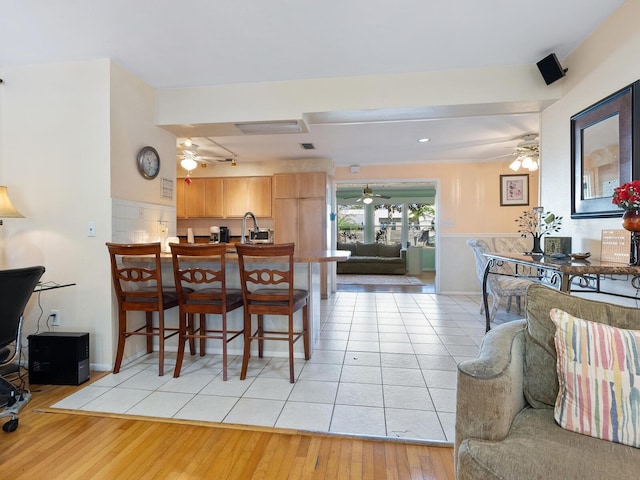 dining area featuring light tile patterned flooring and ceiling fan