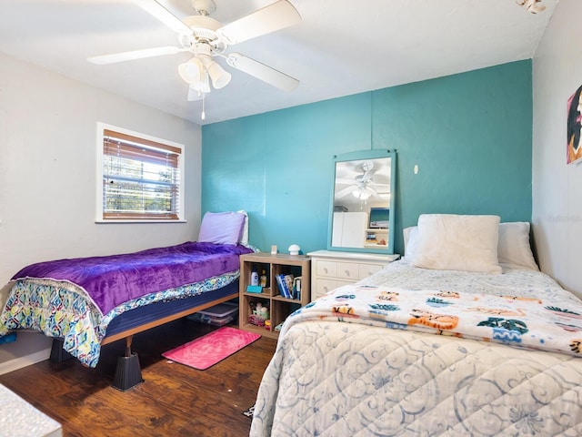 bedroom featuring hardwood / wood-style flooring and ceiling fan