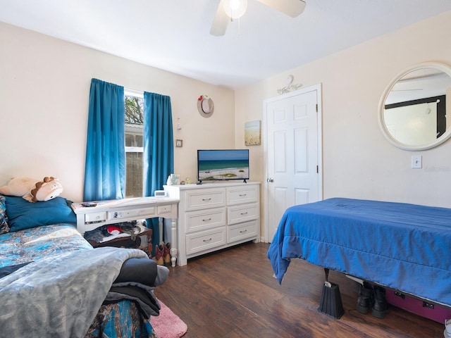 bedroom with dark wood-type flooring and ceiling fan