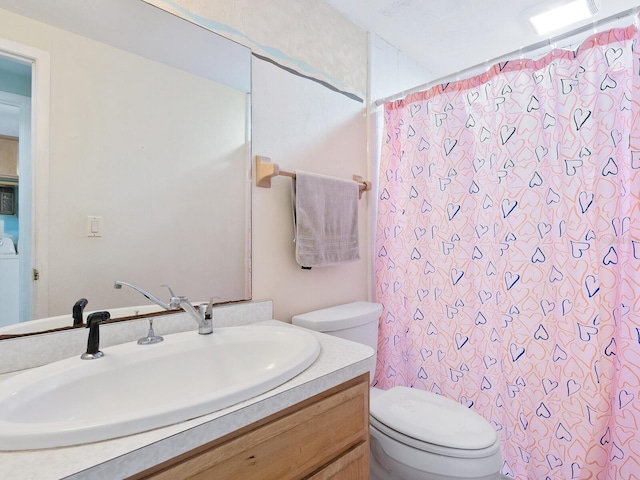 bathroom with vanity, toilet, and walk in shower