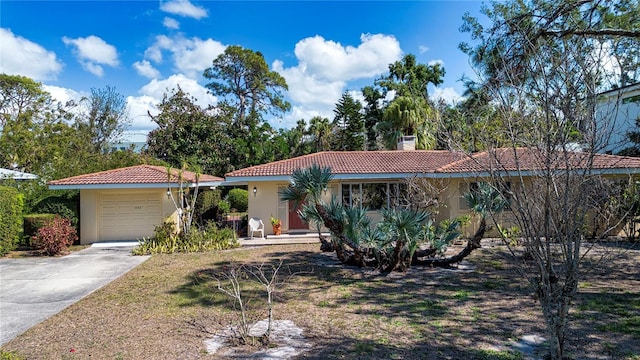 1555 Flower Dr, Sarasota, FL 34239 - view of front of house with a garage