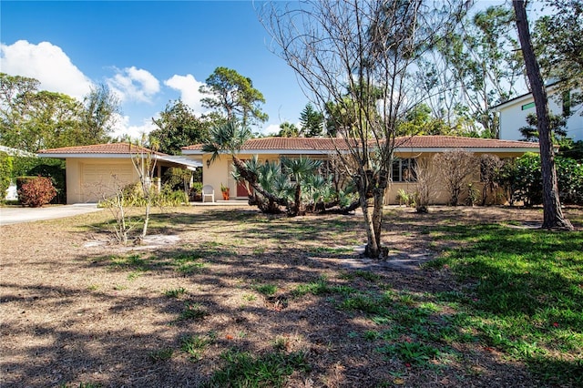 1555 Flower Dr, Sarasota, FL 34239 - ranch-style home featuring a garage