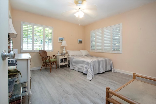 1555 Flower Dr, Sarasota, FL 34239 - bedroom featuring light wood-type flooring and ceiling fan