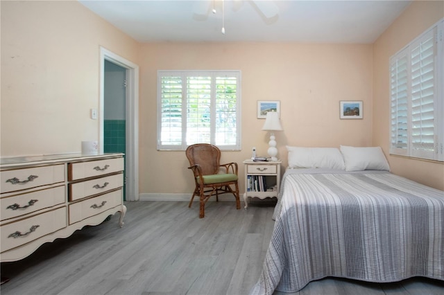 1555 Flower Dr, Sarasota, FL 34239 - bedroom with light hardwood / wood-style floors and ceiling fan