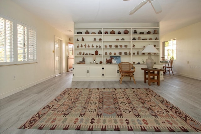1555 Flower Dr, Sarasota, FL 34239 - living area featuring light hardwood / wood-style flooring and ceiling fan