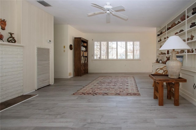 1555 Flower Dr, Sarasota, FL 34239 - foyer entrance featuring ceiling fan and light hardwood / wood-style flooring