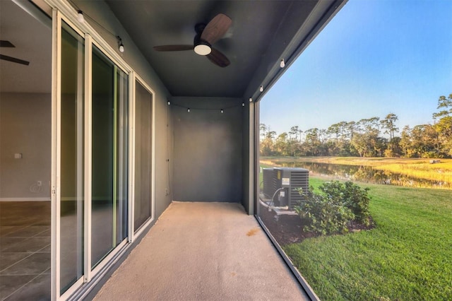 balcony featuring ceiling fan, central AC unit, and a patio