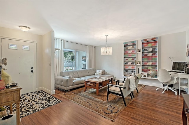 living room with hardwood / wood-style flooring and a chandelier