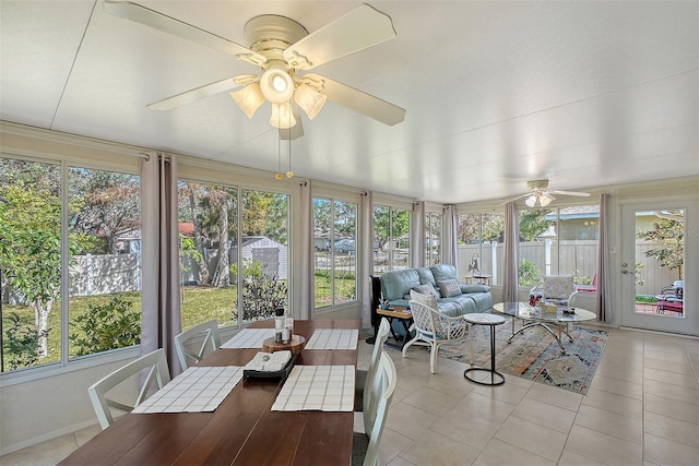 sunroom featuring ceiling fan