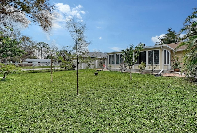 view of yard featuring a sunroom