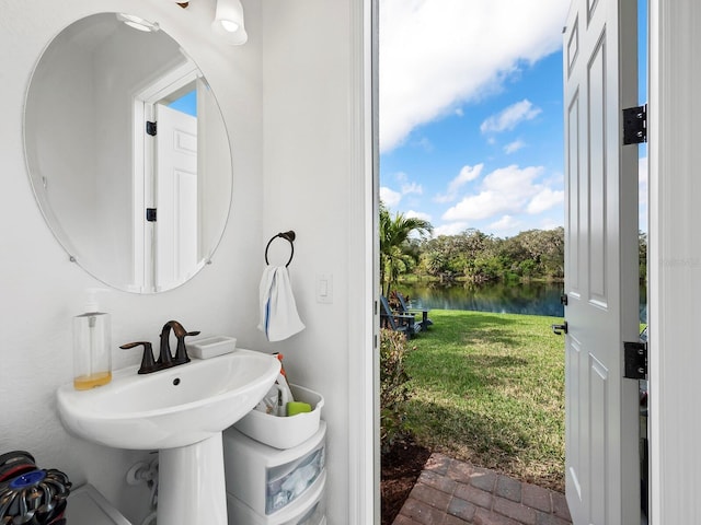 bathroom featuring a water view