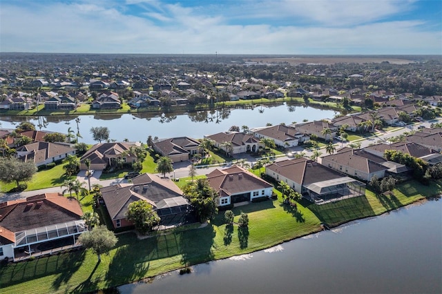 drone / aerial view with a water view