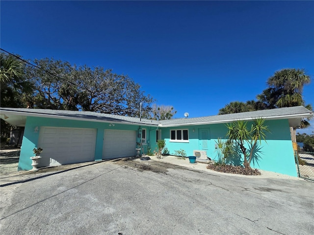 single story home featuring a garage